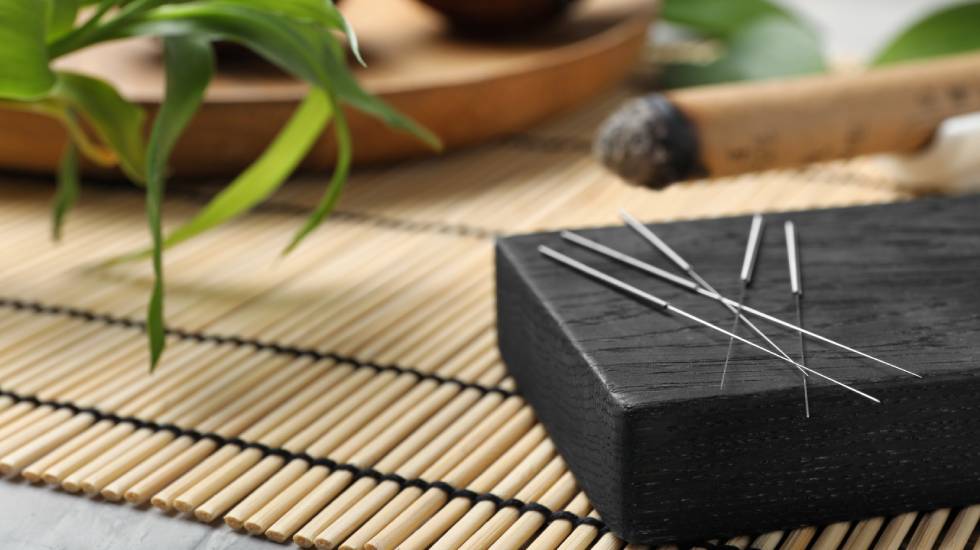 Board with needles for acupuncture on bamboo mat